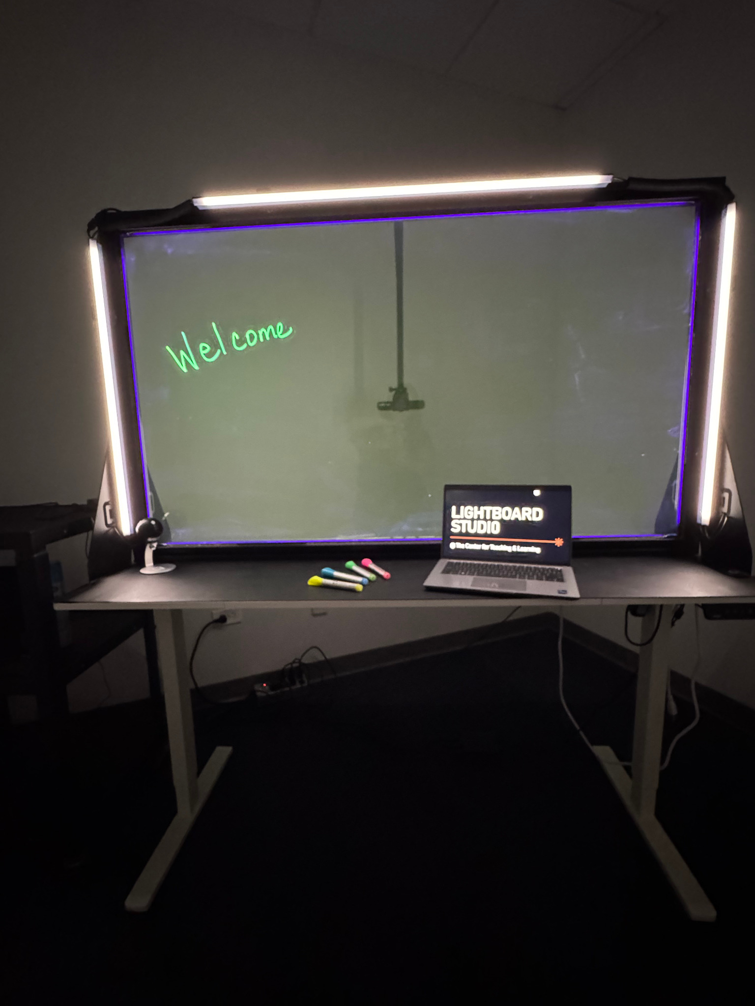 L244H Lightboard Studio with illuminated glass writing surface, studio lighting, markers, and recording workstation