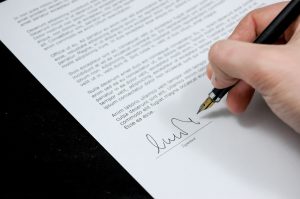Image of a document being signed