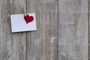 Notecard with a heart on a string