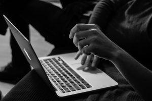 Photo of a person working on a laptop